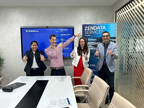 Teams from ZENDATA and Salam Technology celebrate new partnership.