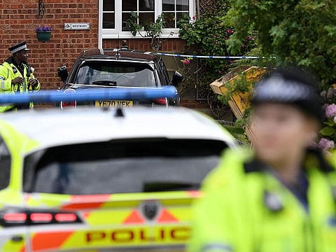 Police stand guard at Ashley Close in Bushey in the borough of Hertfordshire, north of London, on July 10, 2024 after a triple "crossbow attack" murder.