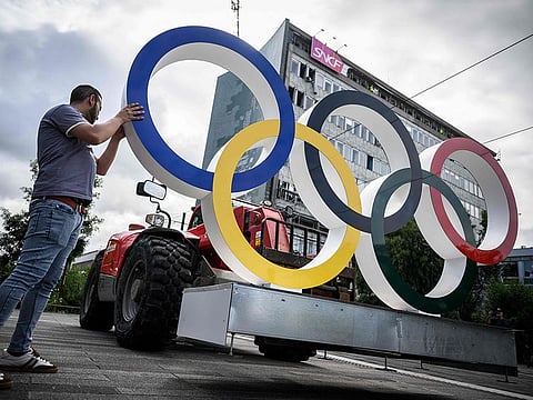 Olympic rings are being installed in front of the Nantes train station in Nantes on July 10, 2024, ahead of the Paris 2024 olympic Games as the city will host part of the Olympic football matches.