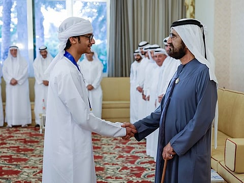 His Highness Sheikh Mohammed bin Rashid Al Maktoum, Vice President and Prime Minister of the UAE and Ruler of Dubai, with Ahmad Faisal Ali, the UAE reading champion on Friday