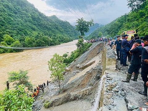 Rescuers search for survivors in river Trishuli in Simaltar, at the site of a landslide.