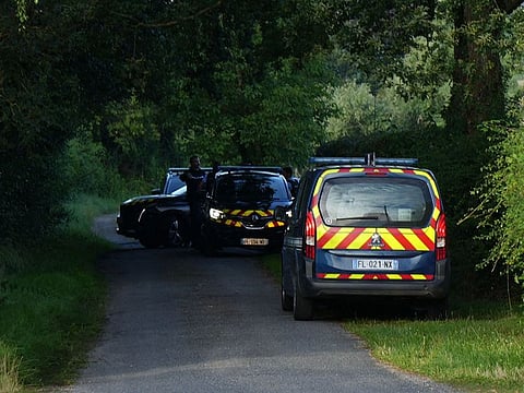 Police officers patrol the street where a shooting took place in the commune of Espinasse-Vozelle in the Allier region, France.