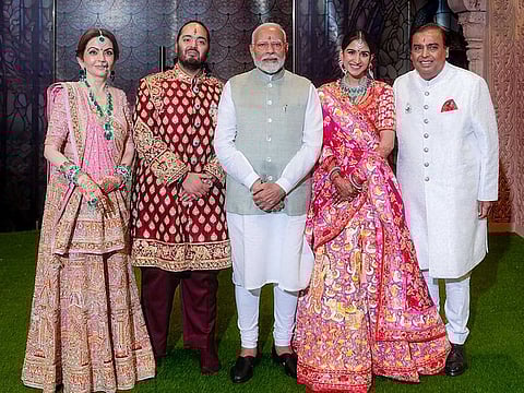 Prime Minister Narendra Modi (centre) with Anant Ambani and Radhika Merchant during their 'Shubh Aashirwad' ceremony at Jio World Centre in Mumbai on Saturday. Reliance Foundation Founder and Chairperson Nita Ambani and her husband and Reliance Industries Chairman Mukesh Ambani also seen.