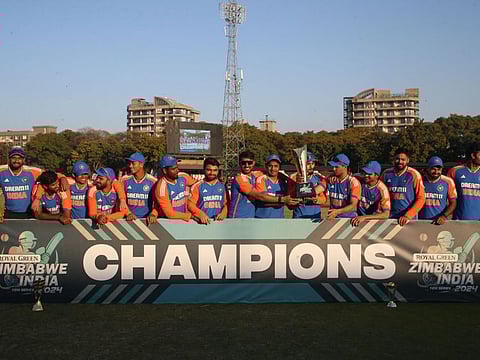 Indian players celebrate with the series trophy after the fifth T20 international cricket match against Zimbabwe at Harare Sports Club in Harare on Sunday.