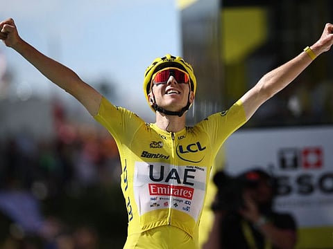 UAE Team Emirates team's Slovenian rider Tadej Pogacar cycles to the finish line to win the 15th stage of the 111th edition of the Tour de France cycling race in the Pyrenees mountains, southwestern France, on Sunday.