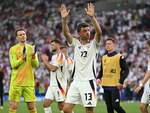 Germany's forward Thomas Mueller greets the fans after the Uefa Euro 2024 quarter-final football match against Spain at the Stuttgart Arena in Stuttgart on July 5.