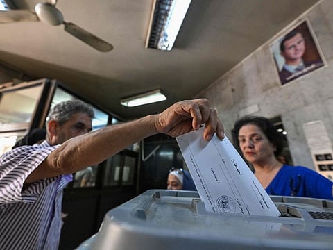 Syrians vote to elect new members of Parliament in Damascus on July 15, 2024.