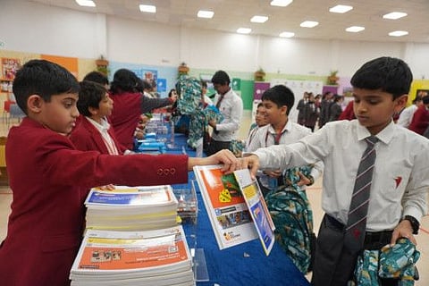 Thousands of students from Dubai school join hands to pack school kits for low-income group of students