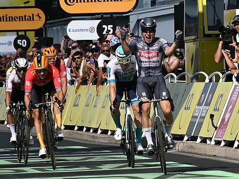 Alpecin-Deceuninck team's Belgian rider Jasper Philipsen cycles to the finish line to win the 16th stage of the 111th edition of the Tour de France cycling race, 188,6km between Gruissan and Nimes, southern France, on Tuesday.