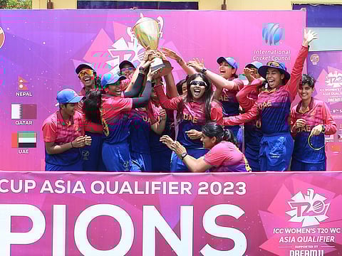 UAE women's team members lift the trophy after winning the ICC Women's T20 World Cup Asia Qualifier in Kuala Lumpur.