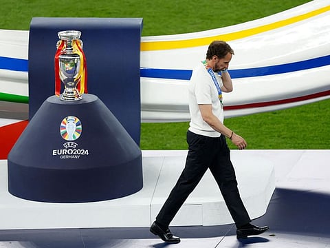 England's head coach Gareth Southgate walks past the trophy after the Uefa Euro 2024 final at the Olympiastadion in Berlin on July 14.