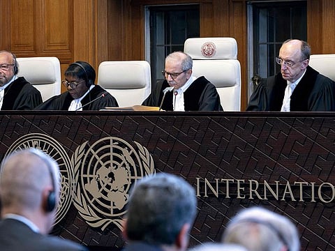 Judge and President of the International Court of Justice (ICJ), Nawaf Salam (2nd R) delivers a non-binding ruling on the legal consequences of the Israeli occupation of the West Bank and East Jerusalem at the International Court of Justice (ICJ) in The Hague on July 19, 2024.