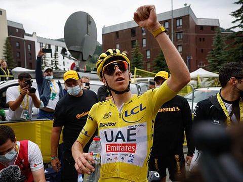 UAE Team Emirates' Tadej Pogacar celebrates after winning the 19th stage of the 111th edition of the Tour de France in the French Alps on Friday.