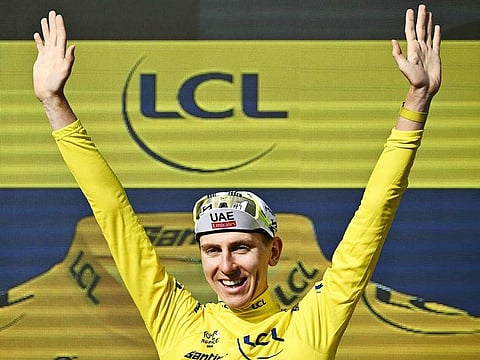 UAE Team Emirates team's Slovenian rider Tadej Pogacar celebrates on the podium with the overall leader's yellow jersey after the 20th stage of the 111th edition of the Tour de France cycling race, 132,8 km between Nice and Col de la Couillole, southeastern France, on July 20, 2024.