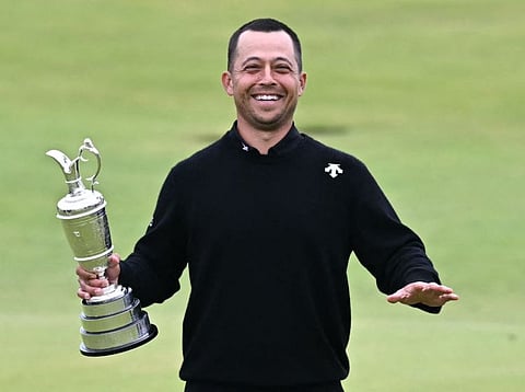 US golfer Xander Schauffele poses with the Claret Jug after winning the 152nd British Open Golf Championship at Royal Troon on the south west coast of Scotland on Sunday.