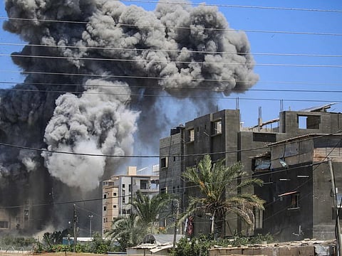 Smoke rises from a building hit by an Israeli strike in Nuseirat in the central Gaza Strip on July 20, 2024.