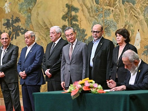 China's Foreign Minister Wang Yi (centre) look on during the signing of the "Beijing declaration" at the Diaoyutai State Guesthouse in Beijing on July 23, 2024.