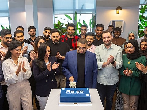 Mahmood Al Saleh, Managing Director, and his team celebrate the rebranding of Gulf Researcher to Reso