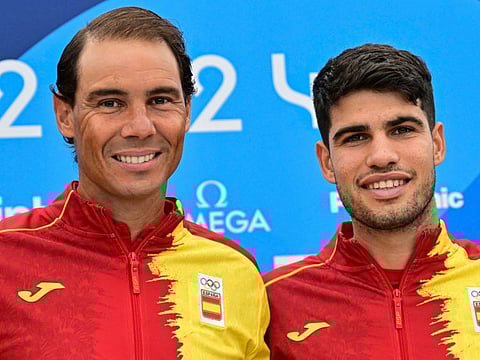 Spain's Rafael Nadal (left) and Carlos Alcaraz pose for pictures during a press conference at the Olympic Village, in Paris, on Wednesday.