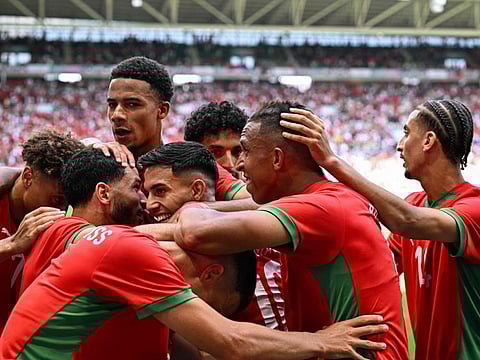 Morocco's forward Soufiane Rahimi (2ndR) celebrates with teammates after scoring his team's first goal in the men's group B football match against Argentina during the Paris 2024 Olympic Games at the Geoffroy-Guichard Stadium in Saint-Etienne on Wednesday.