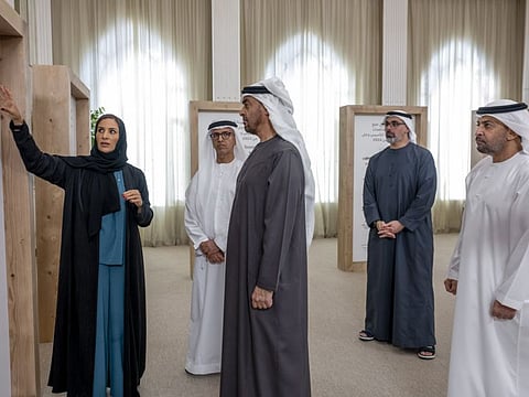 President His Highness Sheikh Mohamed bin Zayed Al Nahyan (2nd L) listens to a presentation by Authority of Social Contribution - Ma'an staff member, during an honouring reception, at the Sea Palace. Seen with Sheikh Hamdan bin Zayed Al Nahyan, Ruler’s Representative in Al Dhafra Region (R) and Sheikh Khaled bin Mohamed bin Zayed Al Nahyan, Crown Prince of Abu Dhabi and Chairman of Abu Dhabi Executive Council (2nd R).