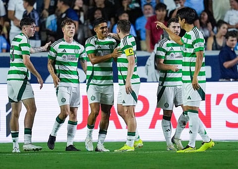 Luis Palma of Celtic celebrates with teammates after a goal against Manchester City during the second half of their pre-season friendly match at Kenan Stadium on Tuesday.