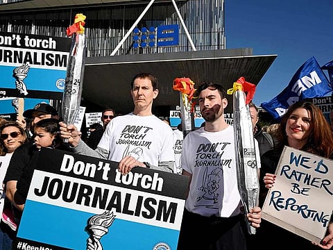 Journalists from The Age newspaper protest outside their offices in Melbourne on July 26, 2024, as some of Australia's largest newspapers launched a rare five-day strike, downing tools ahead of the Olympic opening ceremony due to a rancorous pay dispute.