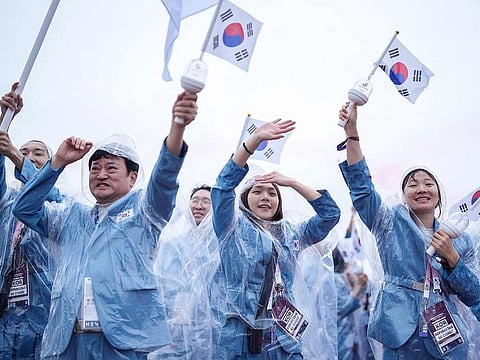 South Korea's delegation sail in a boat along the river Seine during the opening ceremony of the Paris 2024 Olympic Games in Paris on July 26, 2024.