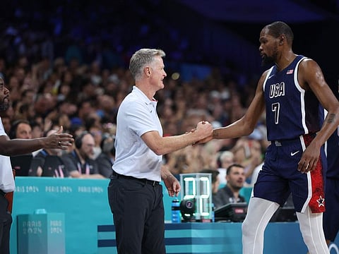 USA's Kevin Durant greets USA's coach Steve Kerr after their men's preliminary round group C basketball match against Serbia at the Pierre-Mauroy stadium on Sunday..