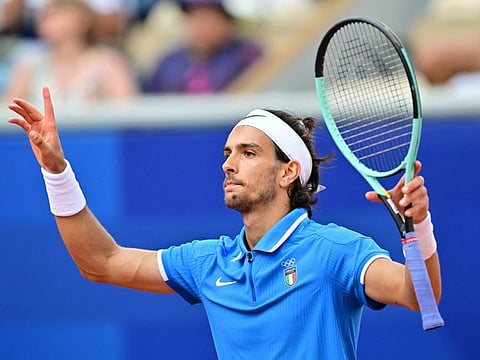 Italy's Lorenzo Musetti reacts to beating France's Gael Monfils in their men's singles first round tennis match on Court Suzanne-Lenglen at the Roland-Garros Stadium at the Paris 2024 Olympic Games, in Paris on Sunday.