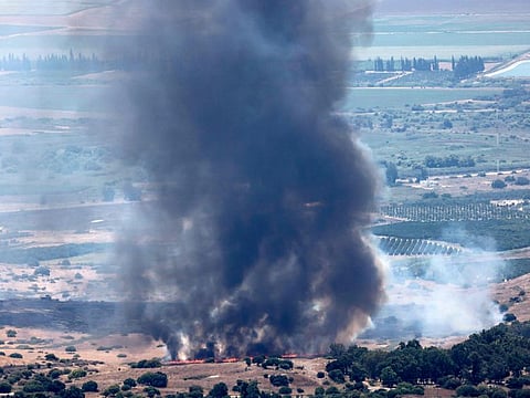 Smoke billows after a hit from a rocket fired from southern Lebanon over the Upper Galilee region in northern Israel on July 21, 2024, amid ongoing cross-border clashes between Israeli troops and Lebanon's Hezbollah militants.