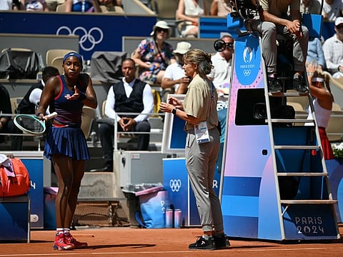 US' Coco Gauff speaks with an official after a call goes against her while playing Croatia's Donna Vekic during their women's singles third round tennis match on Court Philippe-Chatrier at the Roland-Garros Stadium during the Paris 2024 Olympic Games, in Paris on Tuesday.