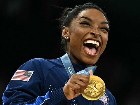 US' Simone Biles poses with the gold medal during the podium ceremony for the artistic gymnastics women's team final during the Paris 2024 Olympic Games at the Bercy Arena in Paris, on Tuesday.