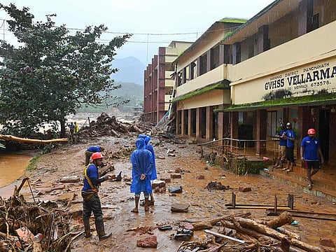 Relief personnel conduct a search and rescue operation at a site following landslides in Wayanad on July 30, 2024.