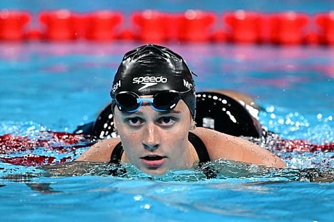 Canada's Summer Mcintosh reacts after a heat of the women's 200m butterfly swimming event during the Paris 2024 Olympic Games at the Paris La Defense Arena in Nanterre, west of Paris, on Wednesday.