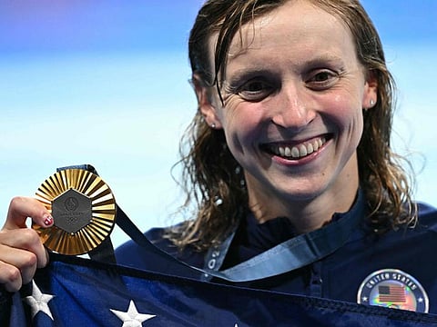 Gold medallist US' Katie Ledecky celebrates during the podium ceremony of the women's 1500m freestyle swimming event during the Paris 2024 Olympic Games at the Paris La Defense Arena in Nanterre, west of Paris, on Wednesday.