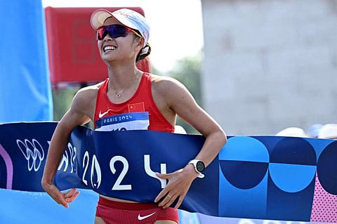 China's Yang Jiayu celebrates after winning the women's 20km race walk of the athletics event at the Paris 2024 Olympic Games at Trocadero in Paris on Thursday.