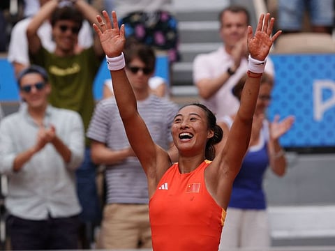 China's Zheng Qinwen celebrates after beating Poland's Iga Swiatek in their women's singles semi-final tennis match on Court Philippe-Chatrier at the Roland-Garros Stadium during the Paris 2024 Olympic Games, in Paris on Thursday.
