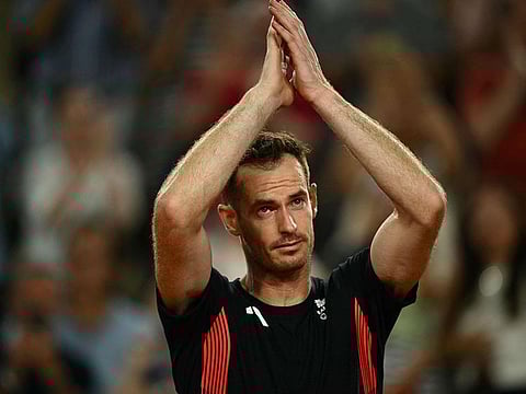 Britain's Andy Murray says goodbye after playing with Britain's Daniel Evans against US' Taylor Fritz and US' Tommy Paul in their men's doubles quarter-final tennis match on Court Suzanne-Lenglen at the Roland-Garros Stadium during the Paris 2024 Olympic Games, in Paris on August 1, 2024.