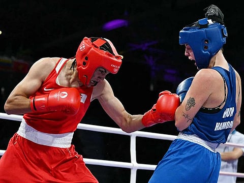 Algeria's Imane Khelif (left) fights against Hungary's Anna Luca Hamori in the women's 66kg quarter-final boxing match during the Paris 2024 Olympic Games at the North Paris Arena, in Villepinte on August 3, 2024.
