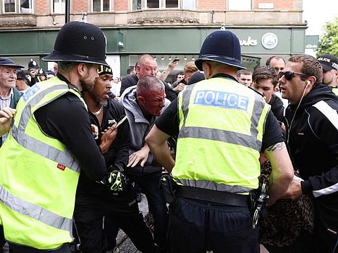 Protesters and counter-protestors scuffle in Nottingham, central England