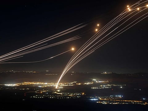 Rockets fired from southern Lebanon are intercepted by Israel's Iron Dome air defence system over the Upper Galilee region in northern Israel, on August 4, 2024.