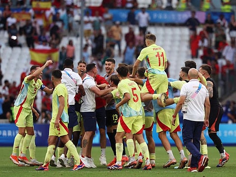 Spain's players celebrate their victory over Morroco at the end of the men's semi-final football match of the Paris 2024 Olympic Games at the Marseille Stadium in Marseille on Monday.