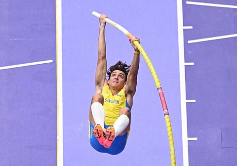 Sweden's Armand Duplantis competes in the men's pole vault qualification of the athletics event at the Paris 2024 Olympic Games at Stade de France in Saint-Denis, north of Paris, on August 3.
