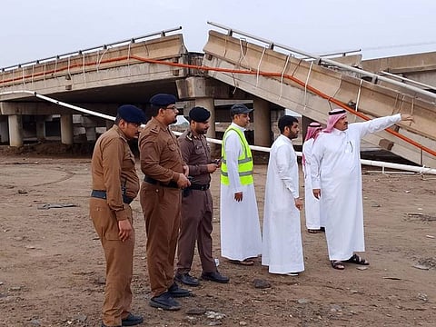 Saudi officials on the scene of the collapsed bridge in Jazan.