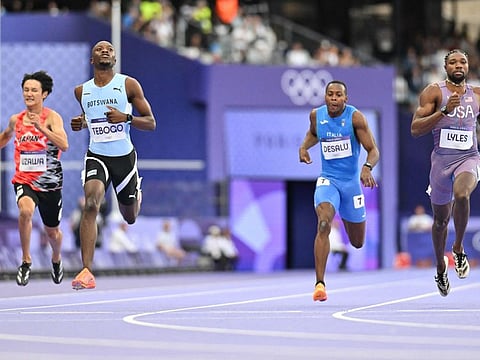 Botswana's Letsile Tebogo (2L) crosses the finish line ahead of US' Noah Lyles (R), Japan's Towa Uzawa and Italy's Eseosa Fostine Desalu in the men's 200m semi-final of the athletics event at the Paris 2024 Olympic Games at Stade de France in Saint-Denis, north of Paris, on Wednesday.