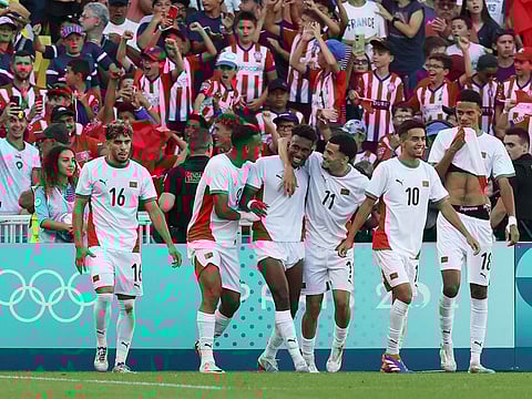 Morocco's defender Akram Nakach (3L) celebrates scoring his team's fifth goal in the men's bronze medal football match against Egypt during the Paris 2024 Olympic Games at the La Beaujoire Stadium in Nantes on Thursday.