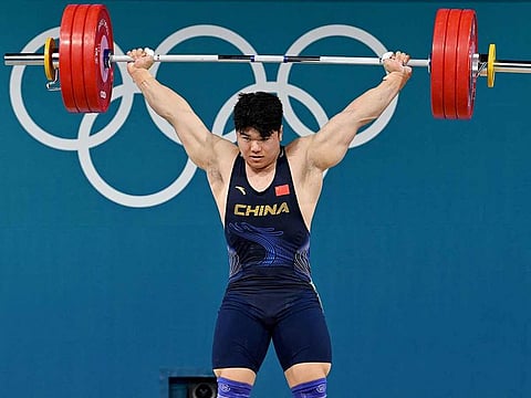 China's Liu Huanhua competes in the men's -102kg weightlifting event during the Paris 2024 Olympic Games at the South Paris Arena in Paris, on August 10, 2024.