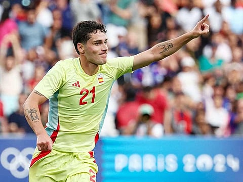 Spain's forward Sergio Camello celebrates after scoring his team's fourth goal in the extra time in the men's gold medal final football match against France during the Paris 2024 Olympic Games at the Parc des Princes in Paris on August 9, 2024.