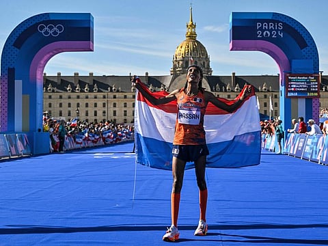 Netherlands' gold medallist Sifan Hassan celebrates after crossing the finish in first place in the women's marathon of the athletics event at the Paris 2024 Olympic Games at The Invalides in Paris on Sunday.